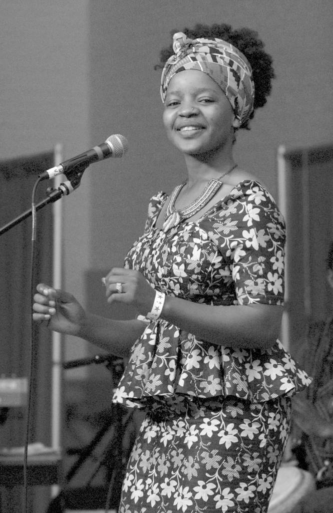 Keith Thorpe/Peninsula Daily News                                Shei Mawa of the world music group Global Heat dances during their Saturday set on the Juan de Fuca Main Stage.