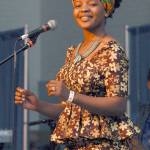 Shei Mawa of the world music group Global Heat dances during their Saturday set on the Juan de Fuca Main Stage. (Keith Thorpe/Peninsula Daily News)