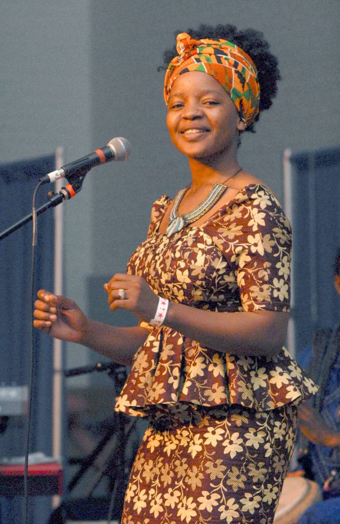 Shei Mawa of the world music group Global Heat dances during their Saturday set on the Juan de Fuca Main Stage. (Keith Thorpe/Peninsula Daily News)