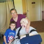 From left, Mikhail Groth-Swartwood, Crystal Groth and Shawn Swartwood at a Port Townsend-area rehabilitation center Friday as Swartwood recovers from a May 18 fall from a Rhododendron Festival Ferris wheel. (Ashton Dennis)