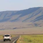 A vehicle drives by the hillsides neighboring the Hanford Nuclear Reservation in Benton County on Tuesday. (Manuel Valdes/The Associated Press)