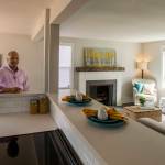 Real estate broker James Pitts III poses in the fully remodeled childhood home of serial murderer Ted Bundy in Tacoma. (Peter Haley/The News Tribune via AP)