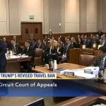 In this image made from a C-SPAN video, Acting Solicitor General Jeffrey Wall, standing at left, presents his arguments during a 9th Circuit Court of Appeals panel in Seattle on Monday. (CSPAN via AP, Pool)