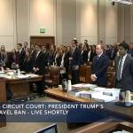 In this image made from a C-SPAN video, participants and members in the gallery stand as three judges for the 9th US Circuit Court of Appeals enter the room in Seattle on Monday. (CSPAN via AP, Pool)