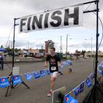 More than 70 participants broke from the starting line at Saturday&rsquo;s Sequim Irrigation Festival Fun Run 5K. Crossing the finish line in first place is Sequim teen Nate Despain. (Matthew Nash/Olympic Peninsula News Group)