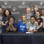 Jeremiah Johnson/Peninsula College Athletics                                The Peninsula College women&rsquo;s basketball team surrounds signees Jenise McKnight, Alicia Dugan and Anaya Rodisha (seated) following a signing ceremony at Peninsula College. Not pictured is Tai Thomas.