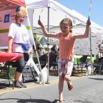 Sophia Heistand of Discovery Bay finishes off 100 turns of the jump rope at last year&rsquo;s Family Fun Day as Kerry Wyamn-Webb looks on. The Fun Day returns Saturday, starting with the Kids Parade at 9 a.m. (Michael Dashiell/Olympic Peninsula News Group)