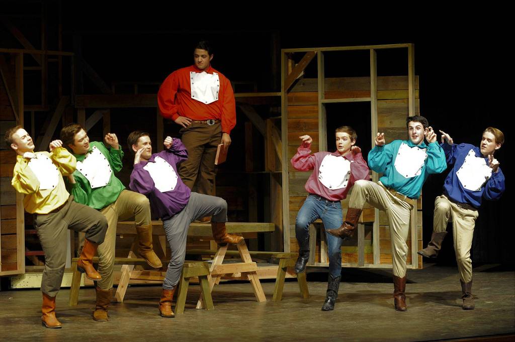 Brothers Caleb (Joe Benjamin), Frank (Tommy Hall), Daniel (Seth Mitchell), Adam (Silas Baird), Gideon (Joey Oliver), Ephraim (Thomas Hughes) and Benjamin (Christopher Heintz), from left, have a man-to-man-to-man talk in &ldquo;Seven Brides for Seven Brothers.&rdquo; (Matthew Nash/Olympic Peninsula News Group)