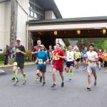 Runners in the North Olympic Discovery Marathon take off early in the morning at 7 Cedars Casino. In front in red is the eventual men&rsquo;s winner Ryan Cox of Bainbridge Island. (Dave Logan/for Peninsula Daily News)