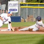 Dave Logan/for Peninsula Daily News Davis Todischuk of Kelowna slides safely into third under the tag of Lefties third baseman Jake Portaro in the second inning of Kelowna&rsquo;s back-and-forth 8-7 win Monday evening.