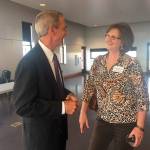 Port Townsend Mayor Deborah Stinson talks with Mitch Dion, one of the finalists for the public works director position. (Cydney McFarland/Peninsula Daily News)