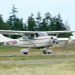 A 1968 Cessna 182L lands at Fairchild International Airport in Port Angeles on Wednesday. The Port of Port Angeles is working to secure commercial air service. (Jesse Major/Peninsula Daily News)