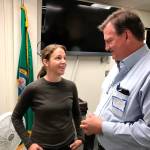 Hilary Franz, state commissioner of public lands, talks with Bill Monahan, a Rayonier forest products company supervisor, before Franz&rsquo;s presentation on a new agency initiative Thursday to a packed audience at the Clallam County Courthouse. (Paul Gottlieb/Peninsula Daily News)