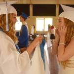 Chimacum seniors Rachel Smith and Jordyn Johnson get ready before their graduation ceremony Saturday in Port Townsend. (Cydney McFarland/Peninsula Daily News)