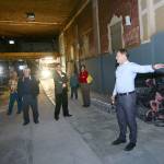 Jacob Oppelt leads a tour of the former Lincoln Theater, which he hopes to revive as a performance venue within the next year, following the Port Angeles Regional Chamber of Commerce luncheon on Wednesday. (Jesse Major/Peninsula Daily News)