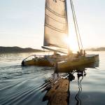 Team Bad Kitty sails into the sunset at the end of Day 3 of Race to Alaska. Bad Kitty is one of three trimarans battling for the lead on the way to Ketchikan, Alaska. (Liv von Oelreich/R2AK)