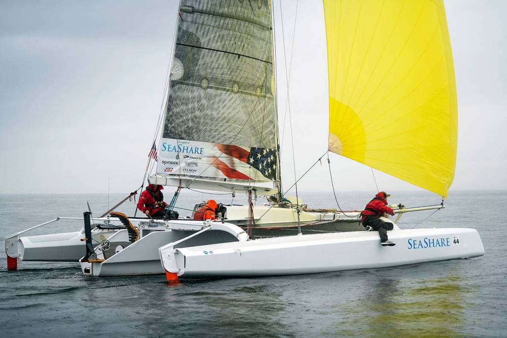 Brothers Tripp, Chris and Trevor Burd of Team Pure & Wild/Freeburd were the first to cross the finish line in Ketchikan after 750 miles of sailing and peddling. (Liv von Oelreich/R2AK)