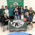 Port Angeles Roughrider Nizhoni Wheeler&rsquo;s family was on-hand Friday as she signed a letter of intent to play both basketballand softball at Lower Columbia Community College in Longview. Wheeler was an all-Olympic league basketball player for theRoughriders her senior season and she was the Olympic League 2A Division MVP in softball. From left back row are LesterMoses, Cheyenne Wheeler, Jason Wheeler, Nizhoni Wheeler, Jarison Moses, Rachelle Wheeler, Skylar Wheeler, Quanah Wheelerand Michelle Charles. Sitting, from left, are Alyce Charles and Frank Charles.