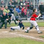 Lions&rsquo; Rylan Politika slides safely into home plate as Local 155 catcher Myles Bowechop catches the ball during Lions&rsquo; 5-4 Cal Ripken Majors City Championship victory.                                Dave Logan/for Peninsula Daily News