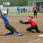 Dave Logan/for Peninsula Daily News Olympic Labor Council&rsquo;s Peyton Rudd slides into third base as Jim Pharmacy&rsquo;s Saylah Commerton prepares to deliver the tag. Rudd was out but OLC won the City Championship 3-0.