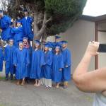 Crescent School secretary Linda Sage, right, takes a group photo of members of the school&rsquo;s class of 2017 before the seniors prepared to march to commencement in the gym Saturday in Joyce. Fifteen seniors were eligible for graduation for the 2016-17 academic year. (Keith Thorpe/Peninsula Daily News)