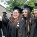 Nursing students, from left, Carrie Bertman of Port Angeles, Michelle Abell-Sietz of Sequim and Jessica Meek of Port Angeles pose for a group selfie while lining up for commencement ceremonies Saturday on the Port Angeles campus of Peninsula College. A total of 275 students were set to take part in the proceedings out of 486 students receiving 600 degrees and certificates. (Keith Thorpe/Peninsula Daily News)