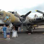 Aviation buffs examine a B-17 bomber during the Wings of Freedom visit to Port Angeles in June 2015. (Keith Thorpe/Peninsula Daily News)