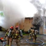 East Jefferson Fire-Rescue firefighters combat a blaze at Custom Auto Craft and Sales, located on Cape George Road, on Saturday evening. (Bill Beezley/East Jefferson Fire-Rescue)