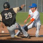 Keith Thorpe/Peninsula Daily News Bend&rsquo;s Derek Chapman tries to make it to second ahead of the throw to Lefties second baseman Seth Freed in the second inning on a breezy Tuesday night at Port Angeles Civic Field.