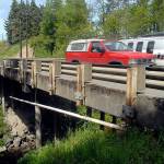 Traffic makes its way across the bridge over McDonald Creek on Old Olympic Highway near Agnew. (Keith Thorpe/Peninsula Daily News)