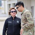 Penny Linterman, Emergency Management Program Coordinator, Clallam County Sheriff&rsquo;s Office, and Capt. Dominique Calata, force protection plans officer, Special Operations Detachment-Pacific, discuss the operations at the William Fairchild Airport.