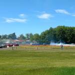 With temperatures Saturday in the mid-90s, two drivers were in mid-burnout down the 1/8-mile drag strip at the West End Thunder drag races at Forks Airport. (Zorina Barker/for Peninsula Daily News)