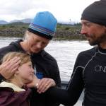 Karl Kruger reunited with his wife, Jessica, and daughter, Dagny, as he arrived Sunday on the dock in Ketchikan, Alaska as the first person to complete the 750-mile Race to Alaska on a paddle board. (Zach Carver/R2AK)