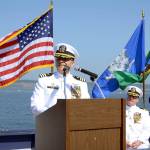 Retired Cmdr. Nick Vande Griend says a few words during the change-of-command ceremony Thursday, when he turned over the command of Naval Magazine Indian Island to Rocky Pulley, back. ​(Cydney McFarland/Peninsula Daily News)