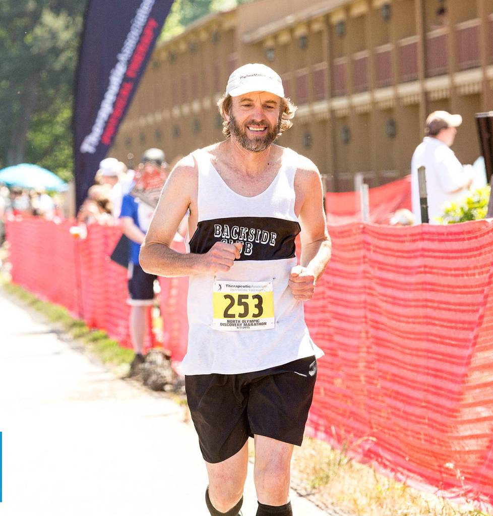 North Olympic Discovery Marathon                                Port Angeles&rsquo; Tom St. Amand nears the finish line of the North Olympic Discovery Marathon in 2015. St. Amand has finished all 14 marathons and will run in the 15th annual event Sunday.