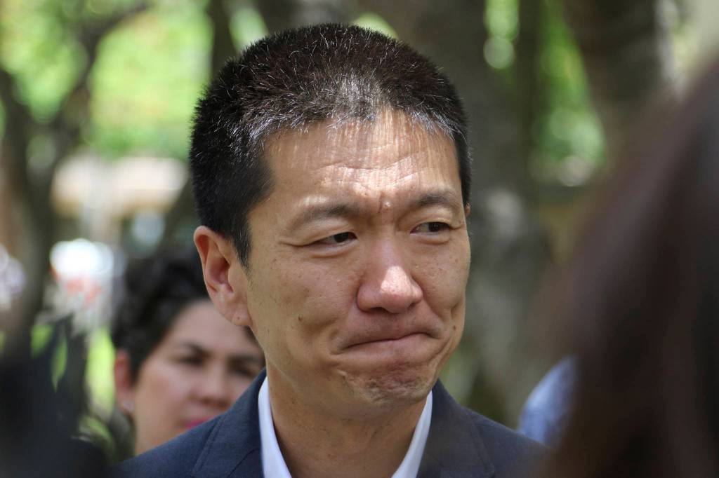 Hawaii Attorney General Douglas Chin talks about a U.S. appeals court decision on President Donald Trump&rsquo;s revised travel ban Monday in Honolulu. (Caleb Jones/The Associated Press)