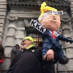 In this Feb. 9 photo, a protester is seen outside the 9th U.S. Circuit Court of Appeals building in San Francisco. (Haven Daley/The Associated Press)
