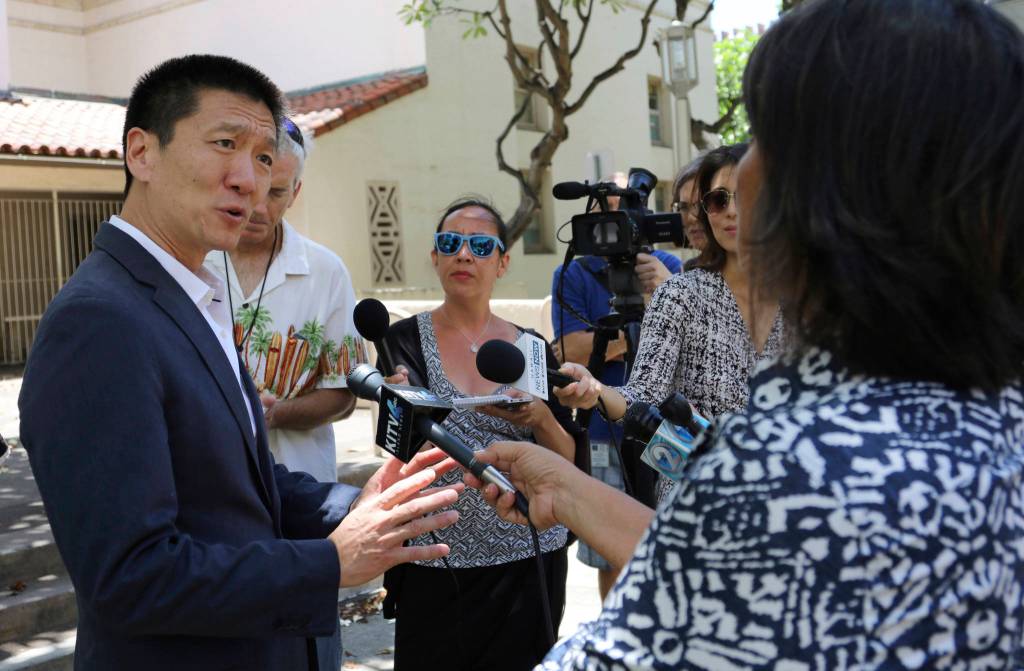 Hawaii Attorney General Douglas Chin talks about a U.S. appeals court decision on President Donald Trump&rsquo;s revised travel ban Monday in Honolulu. (Caleb Jones/The Associated Press)