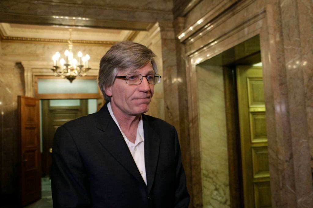 Democratic Rep. Timm Ormsby talks to the media in the House wings about the state of budget negotiations Tuesday in Olympia. (Rachel La Corte/The Associated Press)