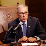 Gov. Jay Inslee talks to reporters about ongoing budget negotiations Tuesday in Olympia. (Rachel La Corte/The Associated Press)