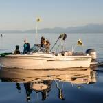 In this 2012 photo provided by the University of Washington, researchers use a boat to shadow southern resident killer whales in the Strait of Juan de Fuca in Washington state. (Jane Cogan/University of Washington via AP)