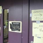 Following Saturday&rsquo;s earthquake drill in Sequim, Community Emergency Response Team members post results of their searches on the front door of Sequim Community School. (Michael Dashiell/Olympic Peninsula News Group)