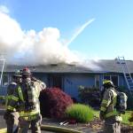 Matthew Nash (2)/Olympic Peninsula News Group                                A fire spread through the attic of a home on the 200 block of Griffith Farm Road on Sunday. Clallam County Fire District No. 3, with support from Clallam County Fire District No. 2 extinguished the fire in about two hours.