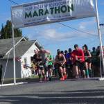 Runners and walkers in the North Olympic Discovery half-marathon got their start at 8 a.m. Saturday along Barr Road opposite the Agnew soccer fields. They were headed for a finish in downtown Port Angeles. (Mark Swanson/Peninsula Daily News)