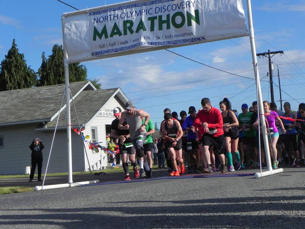 Runners and walkers in the North Olympic Discovery half-marathon got their start at 8 a.m. Saturday along Barr Road opposite the Agnew soccer fields. They were headed for a finish in downtown Port Angeles. (Mark Swanson/Peninsula Daily News)