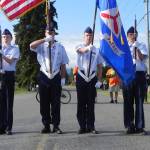 Civil Air Patrol cadets from the Dungeness Composite Squadron in Sequim present the nation&rsquo;s colors at the start of the North Olympic Discovery Marathon and half-marathon in Blyn and Agnew on Saturday morning. In the color guard are cadets Mikhail Ostrovsky, Malachi Delano, Jordan Hurdlow and Dylan Perreira. (Mark Swanson/Peninsula Daily News)