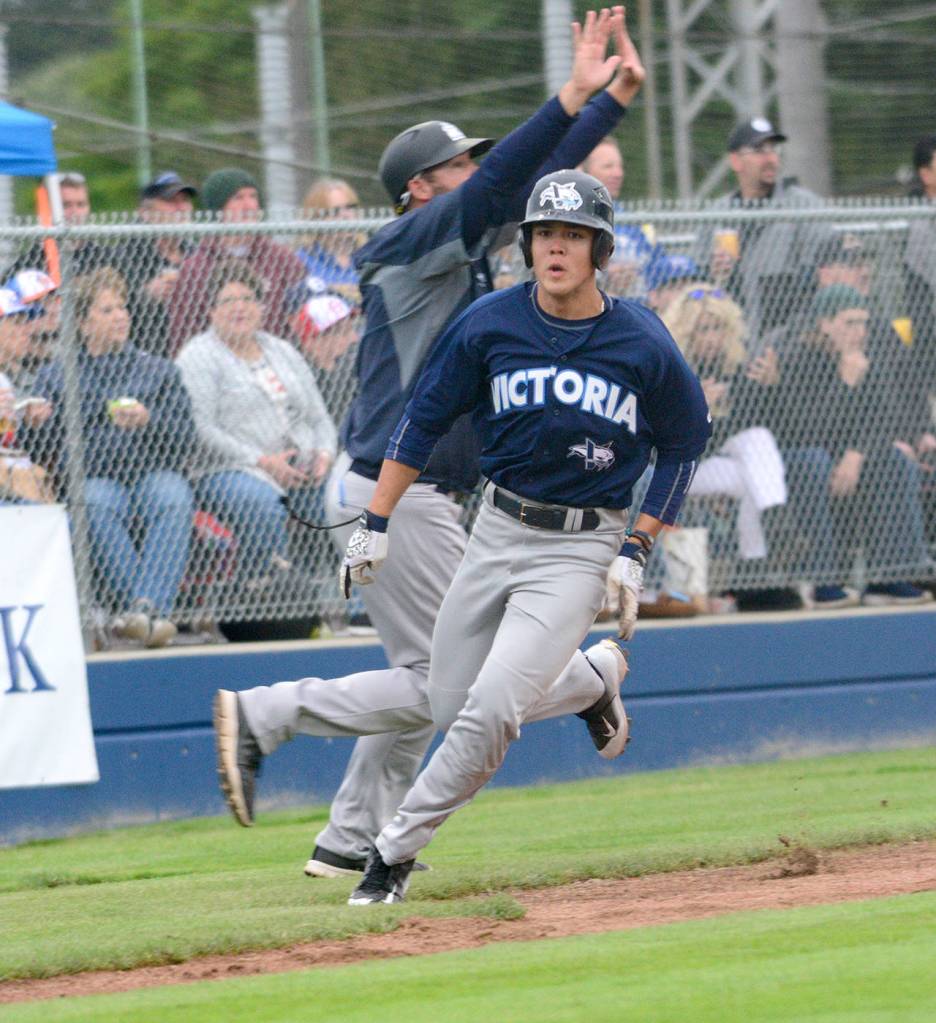 Jesse Major/Peninsula Daily News                                Victoria HarbourCats third baseman Noah Prewett rounds third base and heads for home against the Port Angeles Lefties at Civic Field on Thursday.