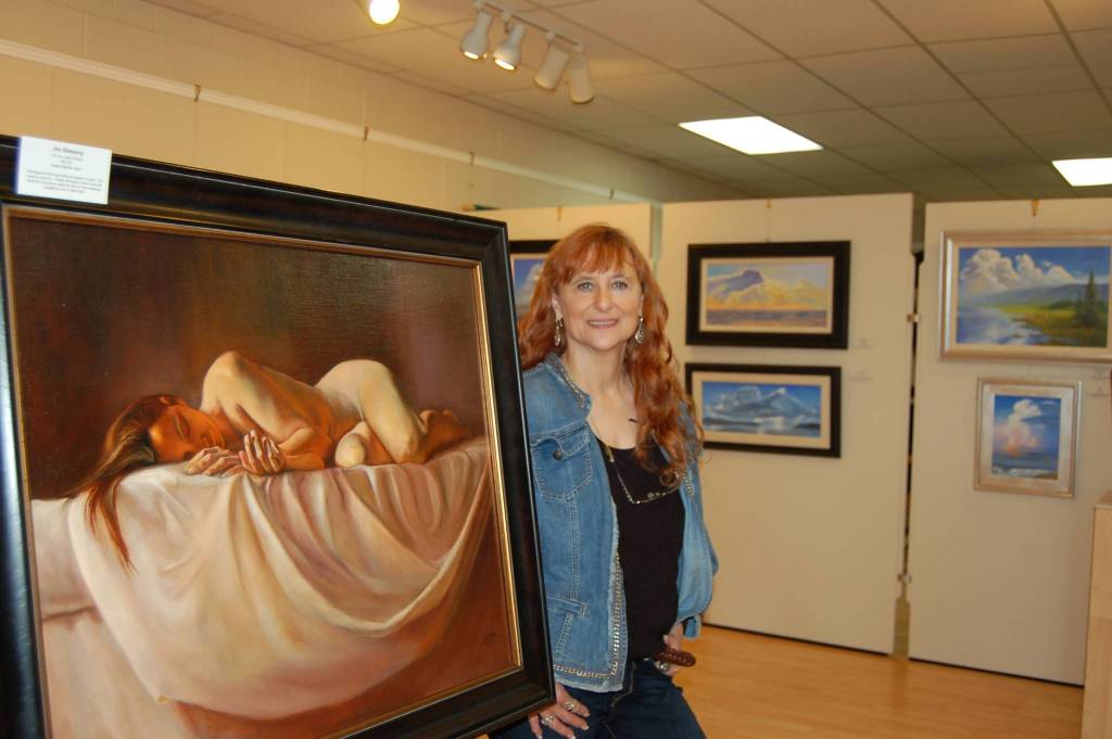 Erin Hawkins/Olympic Peninsula News Group                                Local artist Susan Spar stands next to her exhibit centerpiece, &ldquo;Jen Sleeping,&rdquo; on display at her show &ldquo;People, Places & Things of the Heart&rdquo; at the Sequim Museum & Arts Center. She will hold an artist demonstration and reception Saturday at the MAC.