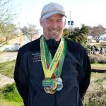 North Olympic Discovery Marathon                                Port Angeles&rsquo; Tom Wahl wears his North Olympic Discovery Marathon medals. Wahl has completed all 14 marathons to date, and will run in Sunday&rsquo;s 15th annual race.