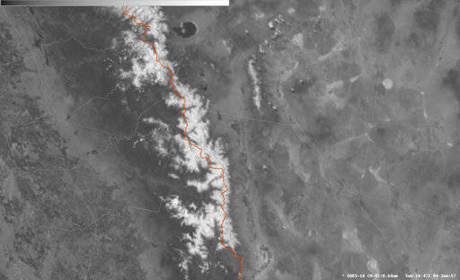 This June 4 satellite photo provided by the U.S. National Weather Service shows the Pacific Crest Trail in California&rsquo;s high Sierra drawn in red surrounded by snowpack. The dream trip of a lifetime has turned to nightmares for some hikers as a massive snowpack in the Sierra Nevada covers the trail and turns rivers to torrents. (U.S. National Weather Service via AP)